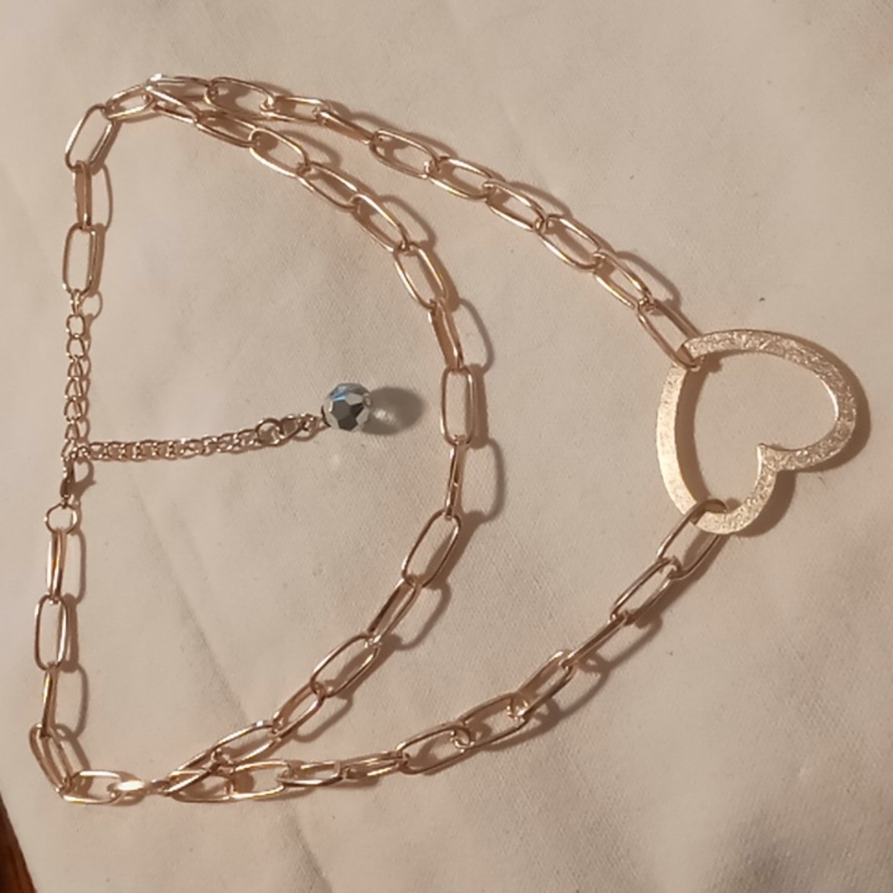 Gold tone oval link chain layered 16-18 +4 with heart Pendant.